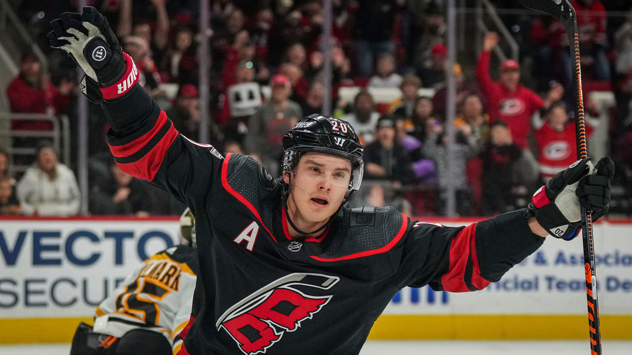 RALEIGH, NORTH CAROLINA - JANUARY 29: Sebastian Aho #20 of the Carolina Hurricanes celebrates after scoring a goal during the first period against the Boston Bruins at PNC Arena on January 29, 2023 in Raleigh, North Carolina.