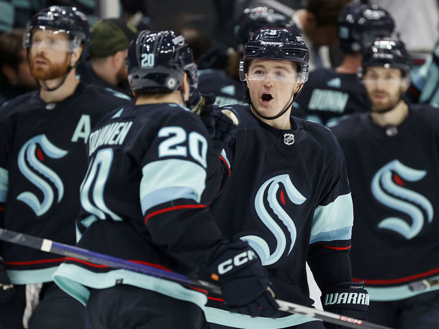 SEATTLE, WASHINGTON - JANUARY 27: Eeli Tolvanen #20 and Ryan Donato #9 of the Seattle Kraken celebrate a goal during the third period against the Calgary Flames at Climate Pledge Arena on January 27, 2023 in Seattle, Washington.