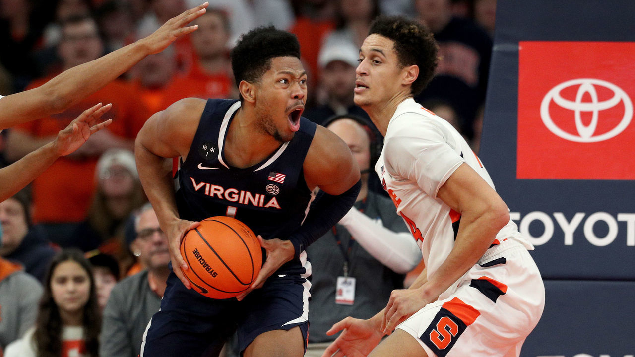 SYRACUSE, NEW YORK - JANUARY 30: Jayden Gardner #1 of the Virginia Cavaliers reacts as Jesse Edwards #14 of the Syracuse Orange guards him as he drives to the basket during the second half at JMA Wireless Dome on January 30, 2023 in Syracuse, New York.