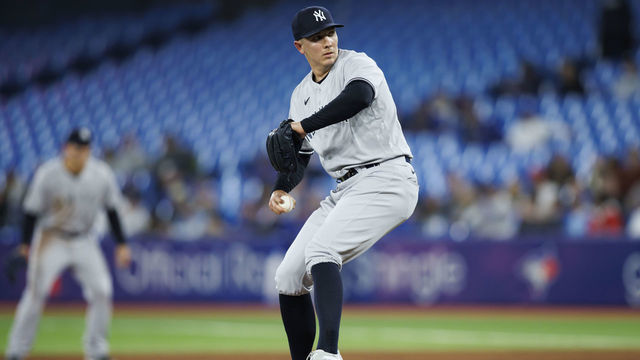 TORONTO, ON - MAY 02: Chad Green #57 of the New York Yankees pitches in the ninth inning of their MLB game against the Toronto Blue Jays at Rogers Centre on May 2, 2022 in Toronto, Canada.