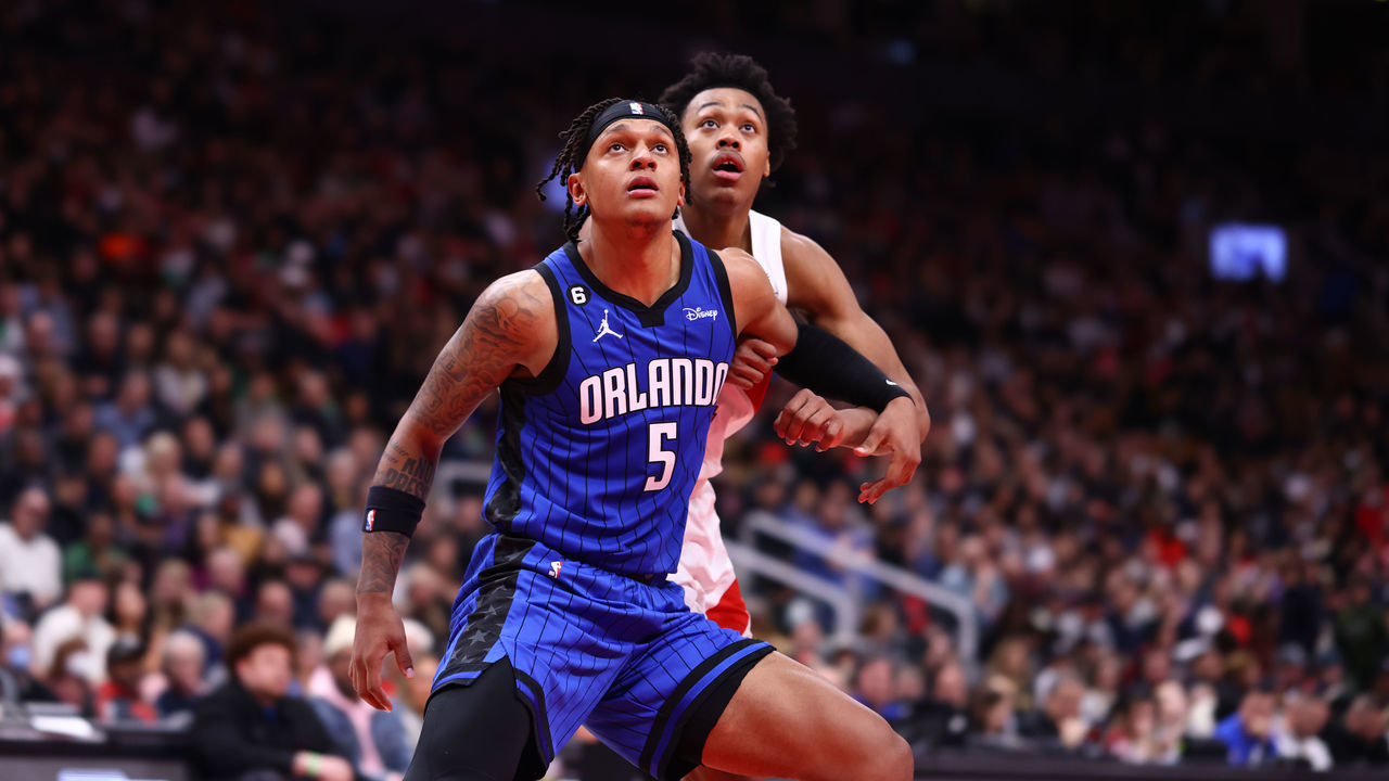TORONTO, CANADA - DECEMBER 3: Paolo Banchero #5 of the Orlando Magic plays defense on Scottie Barnes #4 of the Toronto Raptors during the game on December 3, 2022 at the Scotiabank Arena in Toronto, Ontario, Canada. Mandatory Copyright Notice: Copyright 2022 NBAE