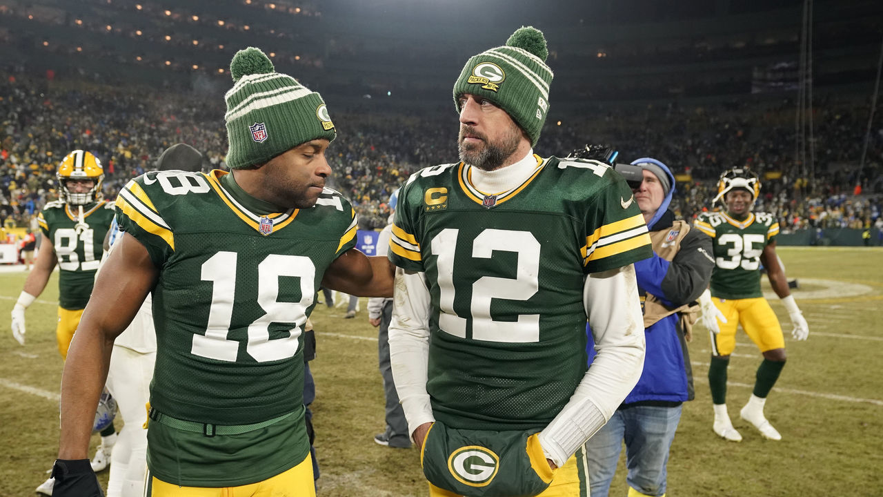 GREEN BAY, WISCONSIN - JANUARY 08: Aaron Rodgers #12 and Randall Cobb #18 of the Green Bay Packers walk off the field after losing to the Detroit Lions at Lambeau Field on January 08, 2023 in Green Bay, Wisconsin.