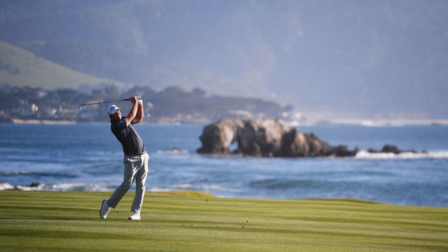 PEBBLE BEACH, CALIFORNIA - FEBRUARY 06: Tom Hoge of the United States plays his second shot on the 18th hole during the final round of the AT&T Pebble Beach Pro-Am at Pebble Beach Golf Links on February 06, 2022 in Pebble Beach, California.