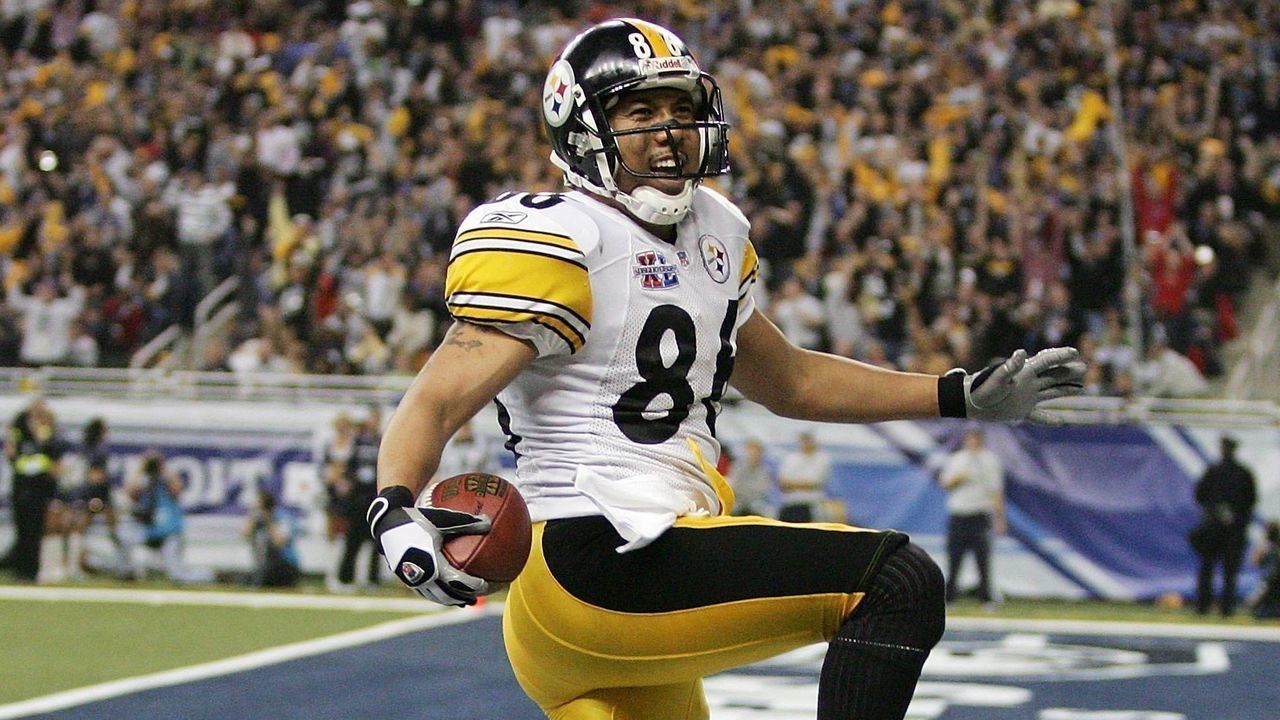 DETROIT - FEBRUARY 05: Wide receiver Hines Ward #86 of the Pittsburgh Steelers scores a touchdown on a pass from receiver Antwaan Randle El #82 in front of cornerback Marcus Trufant #23 of the Seattle Seahawks in the fourth quarter of Super Bowl XL at Ford Field on February 5, 2006 in Detroit, Michigan.