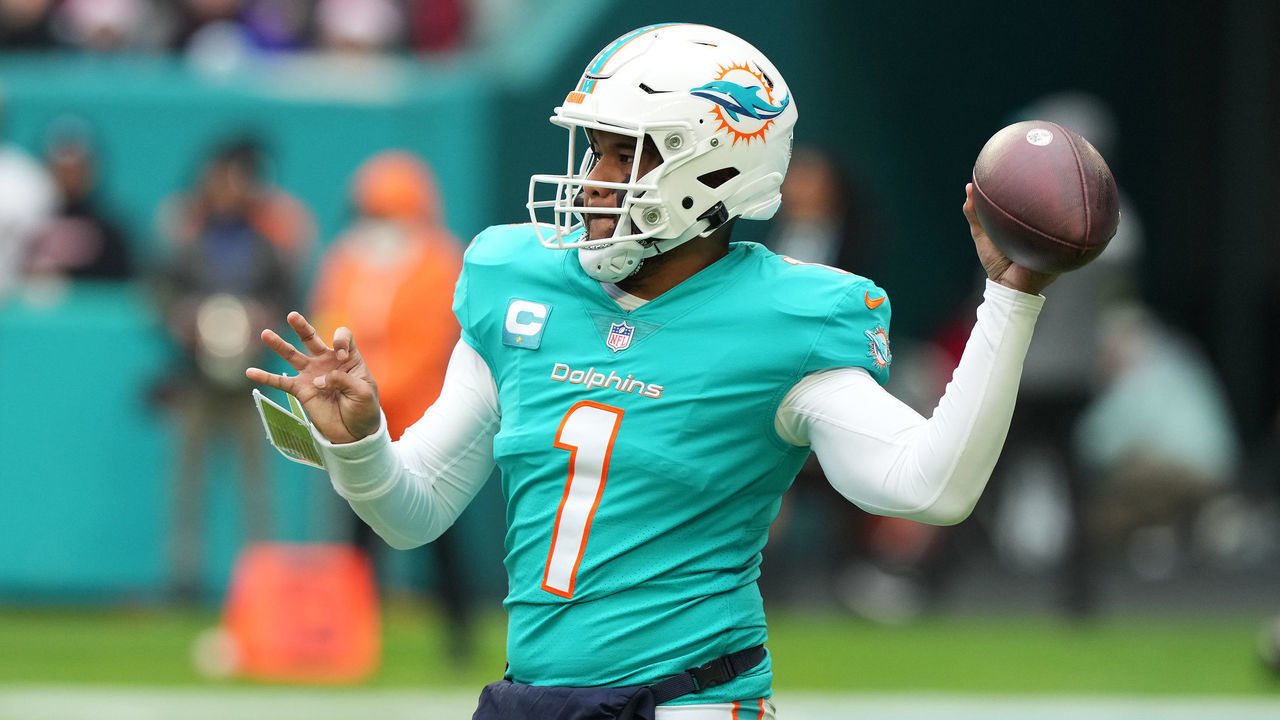 MIAMI GARDENS, FLORIDA - DECEMBER 25: Tua Tagovailoa #1 of the Miami Dolphins throws a touchdown pass during the first quarter of the game against the Green Bay Packers at Hard Rock Stadium on December 25, 2022 in Miami Gardens, Florida.