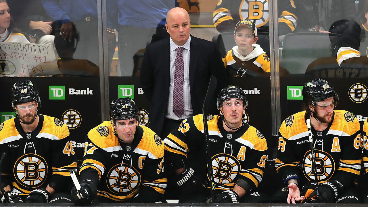Boston, MA - January 12: Boston Bruins head coach Jim Montgomery and from left to right, David Krejci, Patrice Bergeron, Brad Marchand and David Pastrnak, look glum on the bench. The Bruins lost to the Seattle Kraken, 3-0.