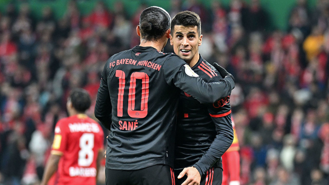 MAINZ, GERMANY - FEBRUARY 01: Leroy Sane of Bayern Munich celebrates with Joao Cancelo of Bayern Munich after scoring the team's third goal during the DFB Cup round of 16 match between 1. FSV Mainz 05 and FC Bayern München at MEWA Arena on February 01, 2023 in Mainz, Germany.