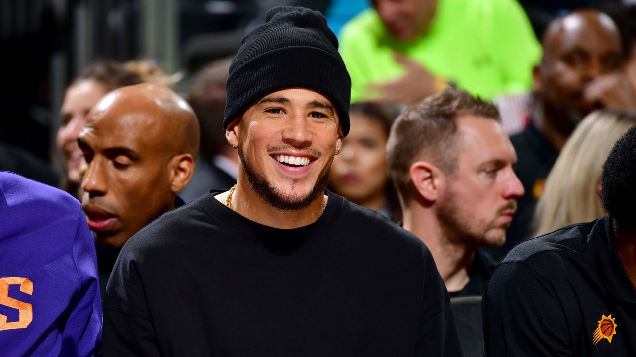 PHOENIX, AZ - JANUARY 30: Devin Booker #1 of the Phoenix Suns looks on during the game against the Toronto Raptors on January 30, 2022 at Footprint Center in Phoenix, Arizona. Mandatory Copyright Notice: Copyright 2022 NBAE