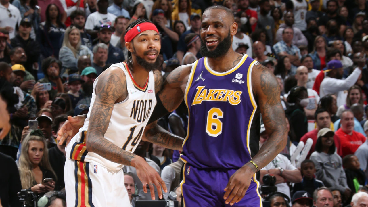 NEW ORLEANS, LA - MARCH 27: Brandon Ingram #14 of the New Orleans Pelicans and LeBron James #6 of the Los Angeles Lakers smile during the game on March 27, 2022 at the Smoothie King Center in New Orleans, Louisiana. Mandatory Copyright Notice: Copyright 2022 NBAE