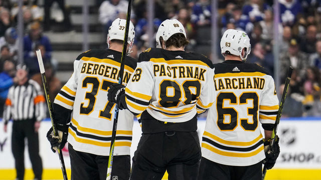 TORONTO, ON - FEBRUARY 1: Patrice Bergeron #37, David Pastrnak #88 and Brad Marchand #63 of the Boston Bruins look on against the Toronto Maple Leafs during the first period at the Scotiabank Arena on February 1, 2023 in Toronto, Ontario, Canada.