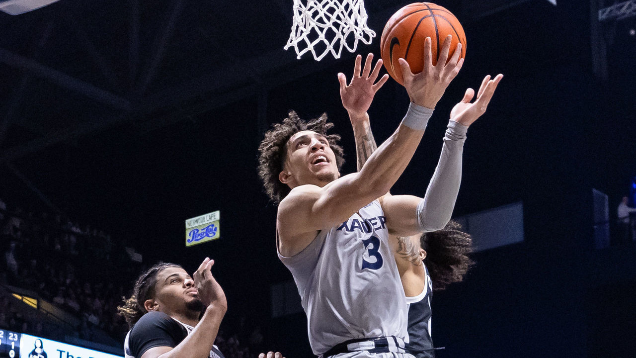 CINCINNATI, OH - FEBRUARY 01: Colby Jones #3 of the Xavier Musketeers shoots the ball during the second half against Bryce Hopkins #23 of the Providence Friars at Cintas Center on February 1, 2023 in Cincinnati, Ohio.
