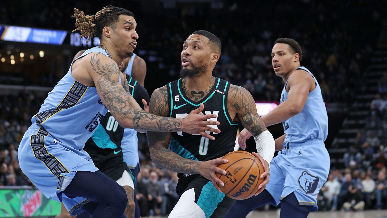 MEMPHIS, TENNESSEE - FEBRUARY 01: Damian Lillard #0 of the Portland Trail Blazers goes to the basket against Brandon Clarke #15 of the Memphis Grizzlies during the first half at FedExForum on February 01, 2023 in Memphis, Tennessee.