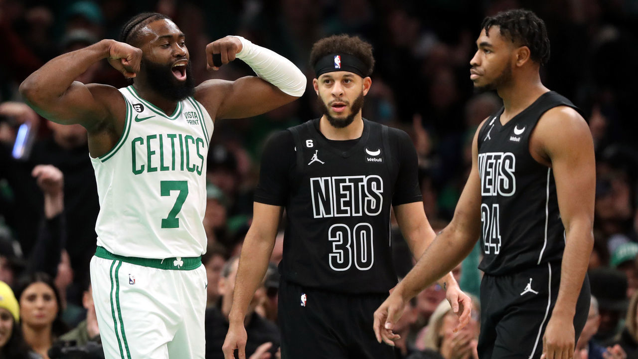 BOSTON, MASSACHUSETTS - FEBRUARY 01: Jaylen Brown #7 of the Boston Celtics celebrates in front of Cam Thomas #24 and Seth Curry #30 of the Brooklyn Nets after scoring during the first half at TD Garden on February 01, 2023 in Boston, Massachusetts.