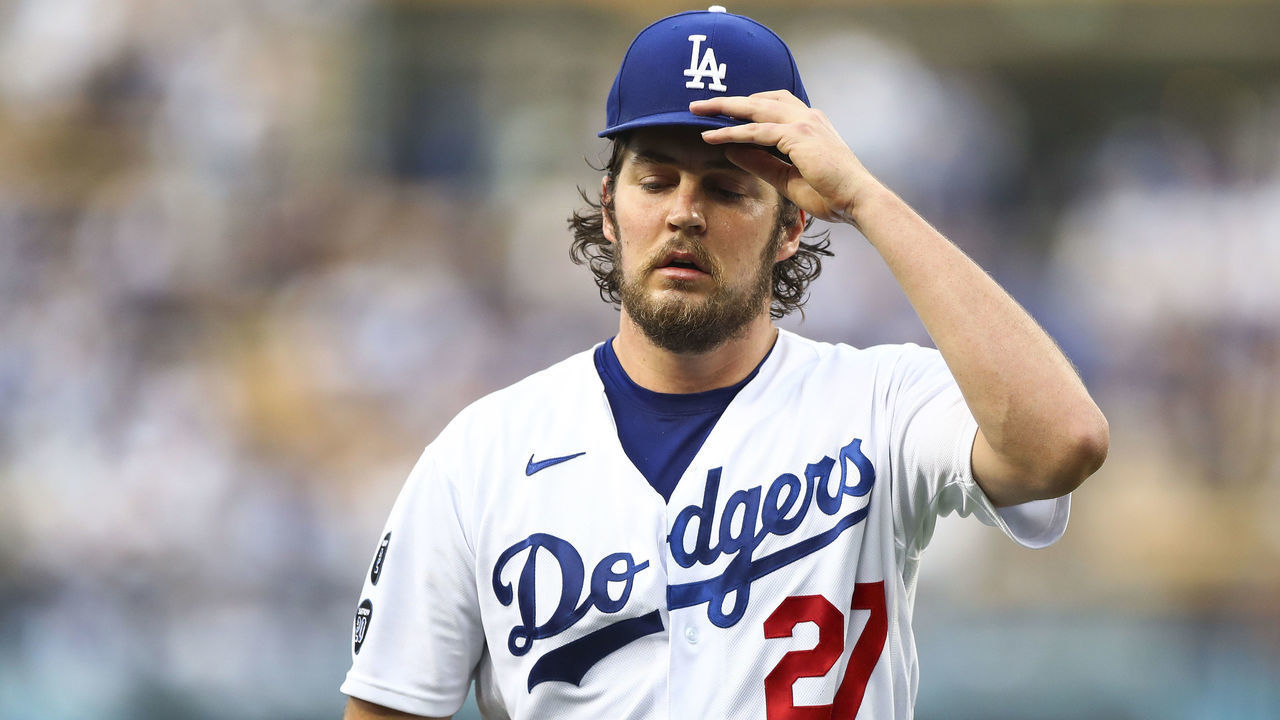 LOS ANGELES, CALIFORNIA - JUNE 28: Trevor Bauer #27 of the Los Angeles Dodgers returns to the dugout after the top of the first inning against the San Francisco Giants at Dodger Stadium on June 28, 2021 in Los Angeles, California.