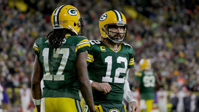 GREEN BAY, WISCONSIN - DECEMBER 25: Davante Adams #17 and Aaron Rodgers #12 of the Green Bay Packers celebrate after scoring a touchdown in the second quarter against the Cleveland Browns at Lambeau Field on December 25, 2021 in Green Bay, Wisconsin.