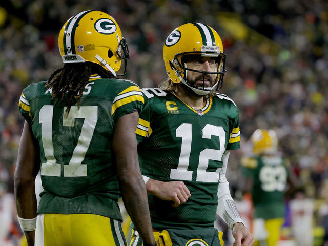 GREEN BAY, WISCONSIN - DECEMBER 25: Davante Adams #17 and Aaron Rodgers #12 of the Green Bay Packers celebrate after scoring a touchdown in the second quarter against the Cleveland Browns at Lambeau Field on December 25, 2021 in Green Bay, Wisconsin.
