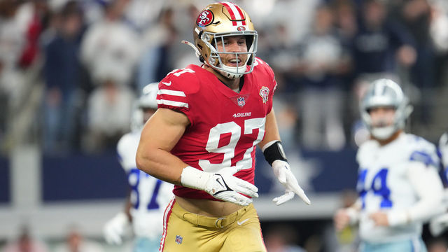 ARLINGTON, TEXAS - JANUARY 16: Nick Bosa #97 of the San Francisco 49ers celebrates after the play against the Dallas Cowboys during an NFL wild-card playoff football game at AT&T Stadium on January 16, 2022 in Arlington, Texas.