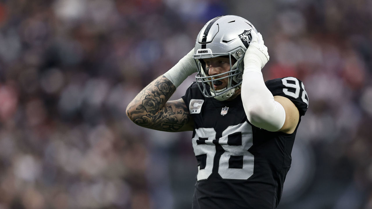 LAS VEGAS, NEVADA - DECEMBER 18: Maxx Crosby #98 of the Las Vegas Raiders adjusts his helmet during an NFL football game between the Las Vegas Raiders and the New England Patriots at Allegiant Stadium on December 18, 2022 in Las Vegas, Nevada.