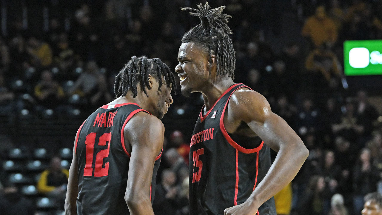 WICHITA, KS - FEBRUARY 02: Jarace Walker #25 and Tramon Mark #12 of the Houston Cougars celebrate after beating the Wichita State Shockers 70-61 at Charles Koch Arena on February 2, 2023 in Wichita, Kansas.