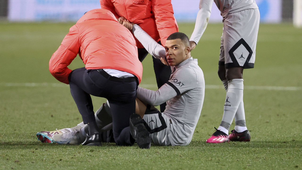 MONTPELLIER, FRANCE - FEBRUARY 1: Injured, Kylian Mbappe of PSG has to leave the pitch during the Ligue 1 match between Montpellier HSC (MHSC) and Paris Saint-Germain (PSG) at Stade de la Mosson on February 1, 2023 in Montpellier, France.