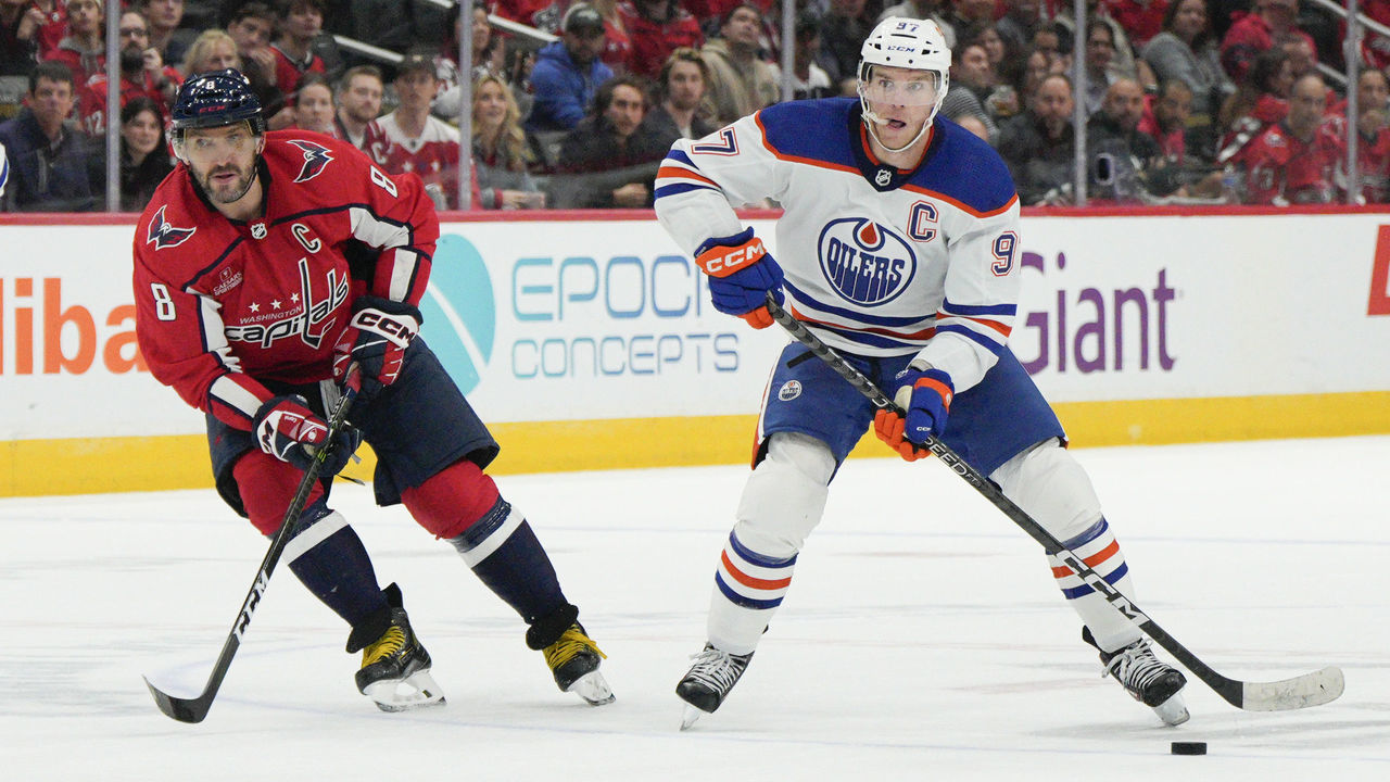 WASHINGTON, DC - NOVEMBER 07: Connor McDavid #97 of the Edmonton Oilers skates with the puck as Alex Ovechkin #8 of the Washington Capitals defends during the third period at Capital One Arena on November 07, 2022 in Washington, DC. This is McDavid's 500th career game.