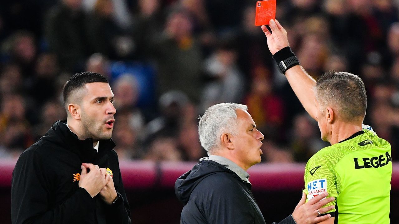AS Roma's Portuguese coach Jose Mourinho (C) reacts as Italian referee Daniele Orsato gives a red card to AS Rome's assitant coach Salvatore Foti (L) during the Italian Serie A football match between AS Rome and Lazio on November 6, 2022 at the Olympic stadium in Rome.