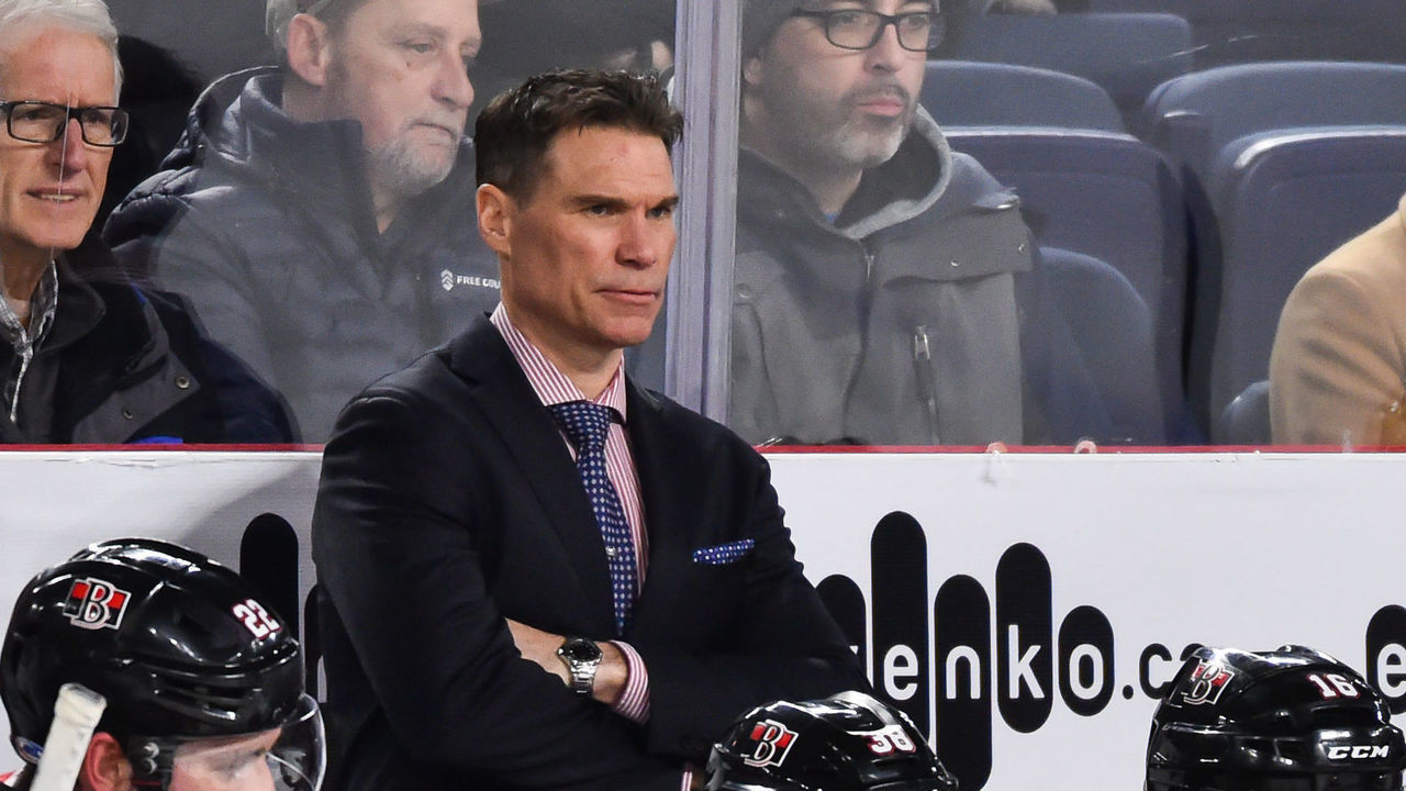 LAVAL, QC - DECEMBER 12: Head coach of the Belleville Senators Troy Mann looks on from behind the bench against the Laval Rocket during the AHL game at Place Bell on December 12, 2018 in Laval, Quebec, Canada. The Laval Rocket defeated the Belleville Senators 3-1.