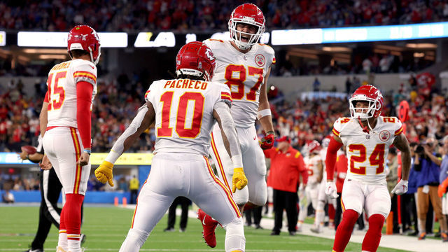 INGLEWOOD, CALIFORNIA - NOVEMBER 20: Travis Kelce #87 of the Kansas City Chiefs celebrates his touchdown catch with Isiah Pacheco #10, to take a 23-20 lead over the Los Angeles Chargers, during a 30-27 Chiefs win at SoFi Stadium on November 20, 2022 in Inglewood, California.