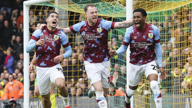NORWICH, ENGLAND - FEBRUARY 04: Burnley's Anass Zaroury (left) celebrates scoring the opening goal with Ashley Barnes and Nathan Tella during the Sky Bet Championship between Norwich City and Burnley at Carrow Road on February 4, 2023 in Norwich, United Kingdom.