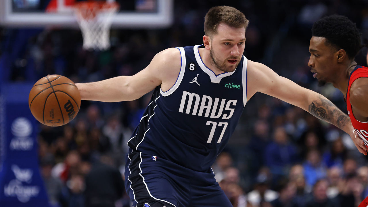 DALLAS, TX - FEBRUARY 2: Luka Doncic #77 of the Dallas Mavericks goes to the basket as Herbert Jones #5 of the New Orleans Pelicans defends in the first half at American Airlines Center on February 2, 2023 in Dallas, Texas.