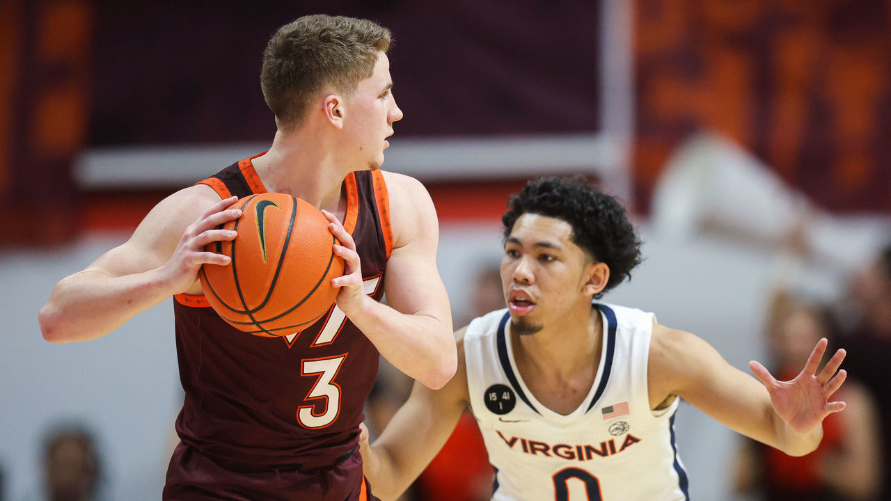 BLACKSBURG, VA - FEBRUARY 04: Sean Pedulla #3 of the Virginia Tech Hokies is defended by Kihei Clark #0 of the Virginia Cavaliers in the first half during a game at Cassell Coliseum on February 4, 2023 in Blacksburg, Virginia.