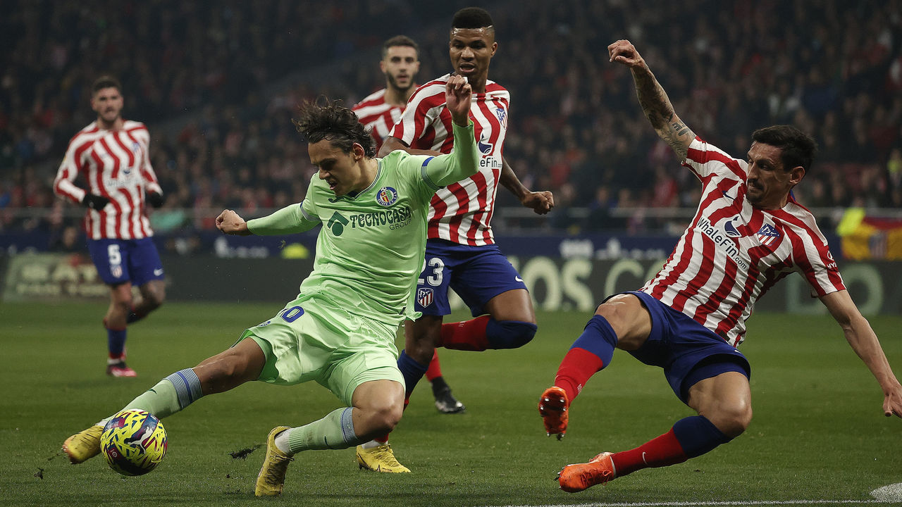 MADRID, SPAIN - FEBRUARY 04: Stefan Savic (R) of Atletico Madrid in action against Enes Unal (L) of Getafe during the LaLiga Santander match between Atletico Madrid and Getafe at Civitas Metropolitano Stadium in Madrid, Spain on February 04, 2023.