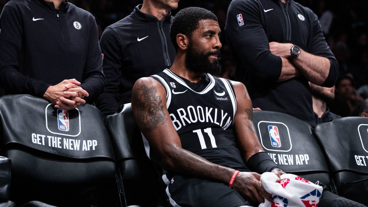 NEW YORK, NEW YORK - NOVEMBER 01: Kyrie Irving #11 of the Brooklyn Nets looks on from the bench during the fourth quarter of the game against the Chicago Bulls at Barclays Center on November 01, 2022 in New York City.