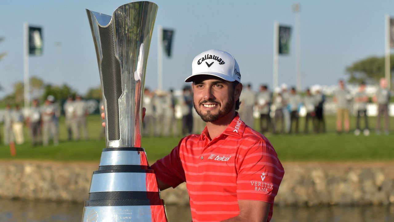Abraham Ancer of Mexico celebrates with the trophy after winning the PIF Saudi International in King Abdullah Economic City, north of Jeddah, on February 5, 2023.