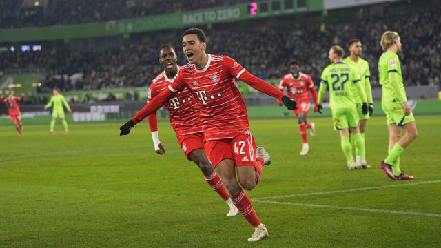 WOLFSBURG, GERMANY - FEBRUARY 05: Jamal Musiala of Bayern Muenchen celebrates the teams fourth goal during the Bundesliga match between VfL Wolfsburg and FC Bayern München at Volkswagen Arena on February 5, 2023 in Wolfsburg, Germany.