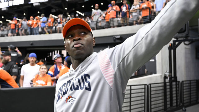 LAS VEGAS, NEVADA - OCTOBER 2: Denver Broncos Defensive Coordinator Ejiro Evero gives a fan a high-five at Allegiant Stadium on October 2, 2022 in Las Vegas, Nevada. The Denver Broncos will take on the home team Las Vegas Raiders during week four of the NFL season.