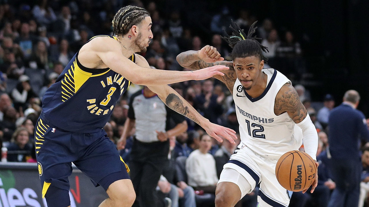 MEMPHIS, TENNESSEE - JANUARY 29: Ja Morant #12 of the Memphis Grizzlies handles the ball against Chris Duarte #3 of the Indiana Pacers during the game at FedExForum on January 29, 2023 in Memphis, Tennessee.