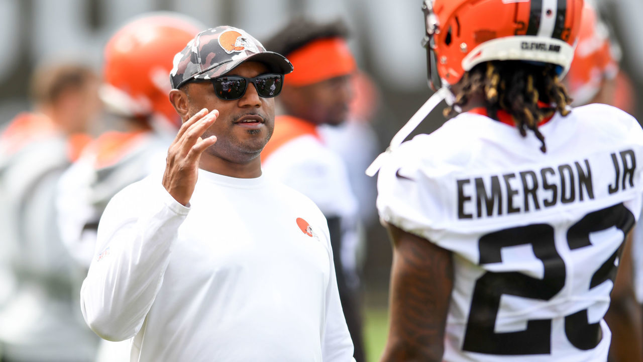 BEREA, OH - MAY 25: Defensive coordinator Joe Woods of the Cleveland Browns walks with Martin Emerson Jr. #23 during the Cleveland Browns OTAs at CrossCountry Mortgage Campus on May 25, 2022 in Berea, Ohio.