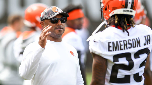BEREA, OH - MAY 25: Defensive coordinator Joe Woods of the Cleveland Browns walks with Martin Emerson Jr. #23 during the Cleveland Browns OTAs at CrossCountry Mortgage Campus on May 25, 2022 in Berea, Ohio.