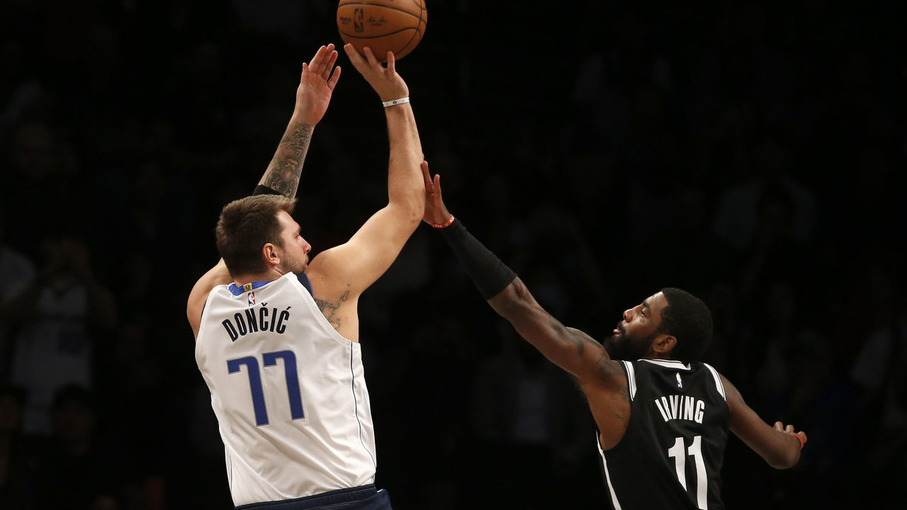 NEW YORK, NEW YORK - OCTOBER 27: (NEW YORK DAILIES OUT) Luka Doncic #77 of the Dallas Mavericks in action against Kyrie Irving #11 of the Brooklyn Nets at Barclays Center on October 27, 2022 in New York City. The Mavericks defeated the Nets 129-125 in overtime.