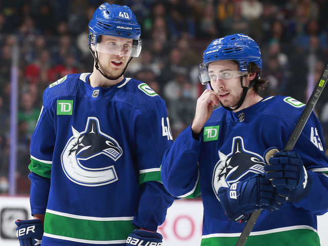 VANCOUVER, CANADA - JANUARY 5: Elias Pettersson #40 of the Vancouver Canucks talks to teammate Quinn Hughes #43 during their NHL game against the Colorado Avalanche at Rogers Arena January 5, 2023 in Vancouver, British Columbia, Canada.