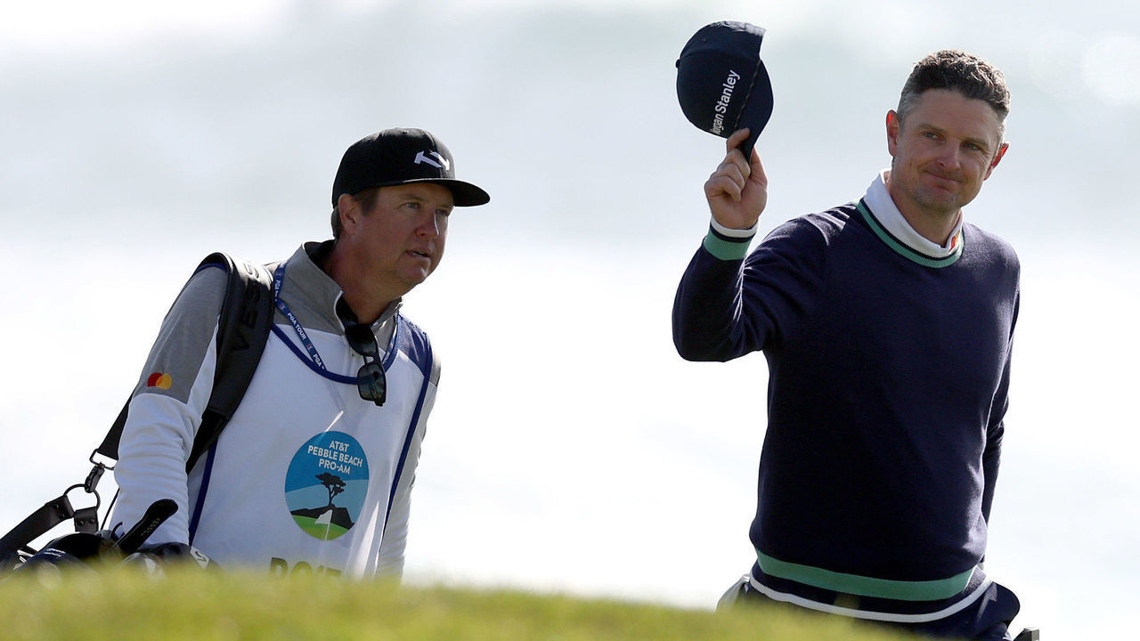 PEBBLE BEACH, CALIFORNIA - FEBRUARY 06: Justin Rose of England waves to applause as he makes his way to the 18th green during the continuation of the final round of the AT&T Pebble Beach Pro-Am at Pebble Beach Golf Links on February 06, 2023 in Pebble Beach, California.