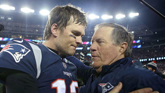 (012118 Foxboro, MA) New England Patriots quarterback Tom Brady hugs head coach Bill Belichick after winning the AFC Championship game at Gillette Stadium on Sunday, January 21, 2018. Staff Photo by Nancy Lane