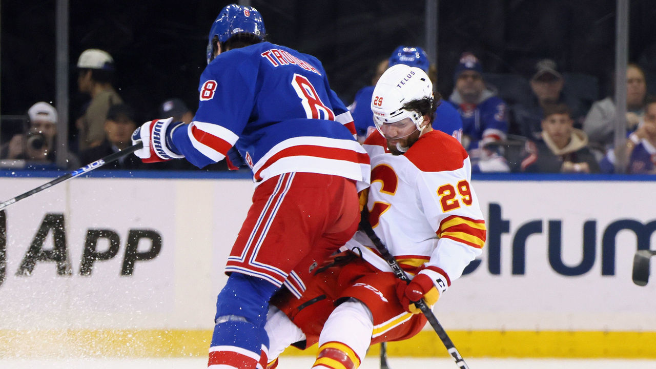 NEW YORK, NEW YORK - FEBRUARY 06: Jacob Trouba #8 of the New York Rangers steps into Dillon Dube #29 of the Calgary Flames during the first period at Madison Square Garden on February 06, 2023 in New York City.