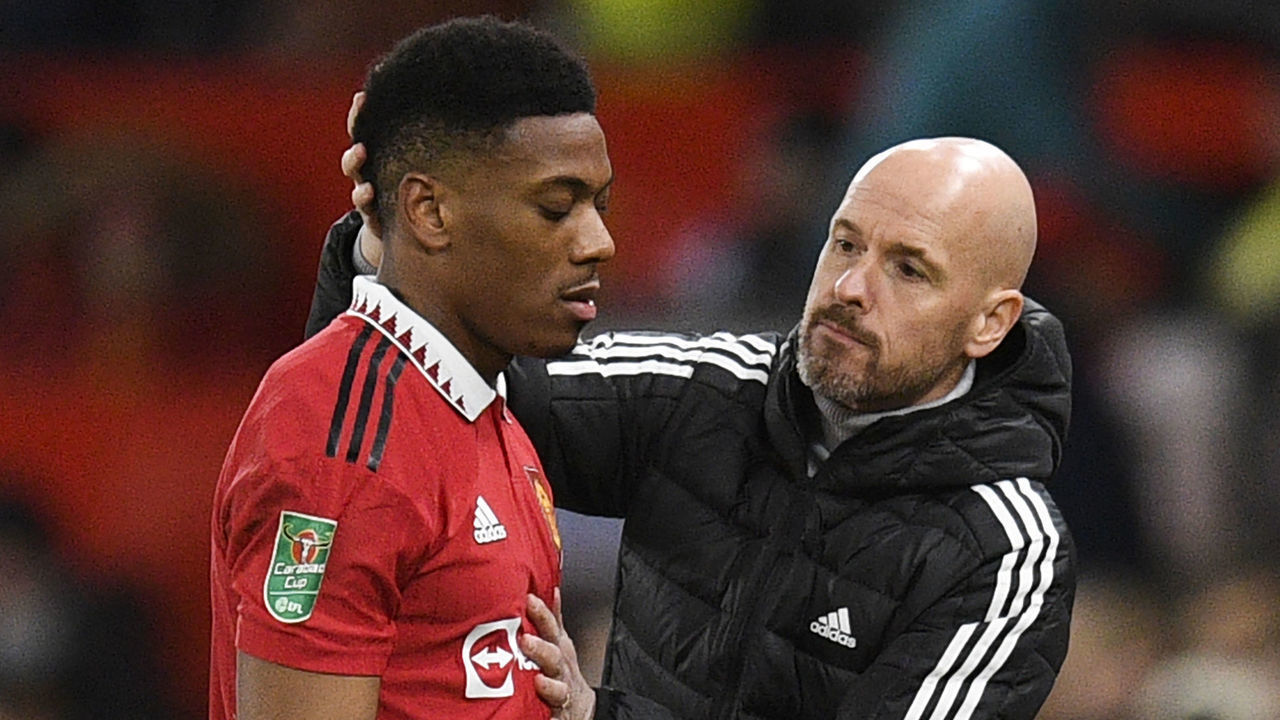 Manchester United's French striker Anthony Martial is congratulated by Manchester United's Dutch manager Erik ten Hag as he leaves the pitch during the English League Cup fourth round football match between Manchester United and Burnley, at Old Trafford, in Manchester, on December 21, 2022. - - RESTRICTED TO EDITORIAL USE. No use with unauthorized audio, video, data, fixture lists, club/league logos or 'live' services. Online in-match use limited to 120 images. An additional 40 images may be used in extra time. No video emulation. Social media in-match use limited to 120 images. An additional 40 images may be used in extra time. No use in betting publications, games or single club/league/player publications.
