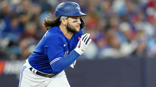 TORONTO, - OCTOBER 08: Bo Bichette #11 of the Toronto Blue Jays doubles in the fifth inning during the Wild Card Series game between the Seattle Mariners and the Toronto Blue Jays at Rogers Centre on Saturday, October 8, 2022 in Toronto, Canada.
