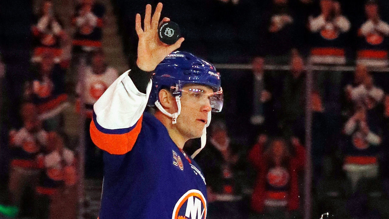 ELMONT, NEW YORK - FEBRUARY 07: Bo Horvat #14 of the New York Islanders is named the first star of the game against the Seattle Kraken at UBS Arena on February 07, 2023 in Elmont, New York. The Islanders shut out the Kraken 4-0.
