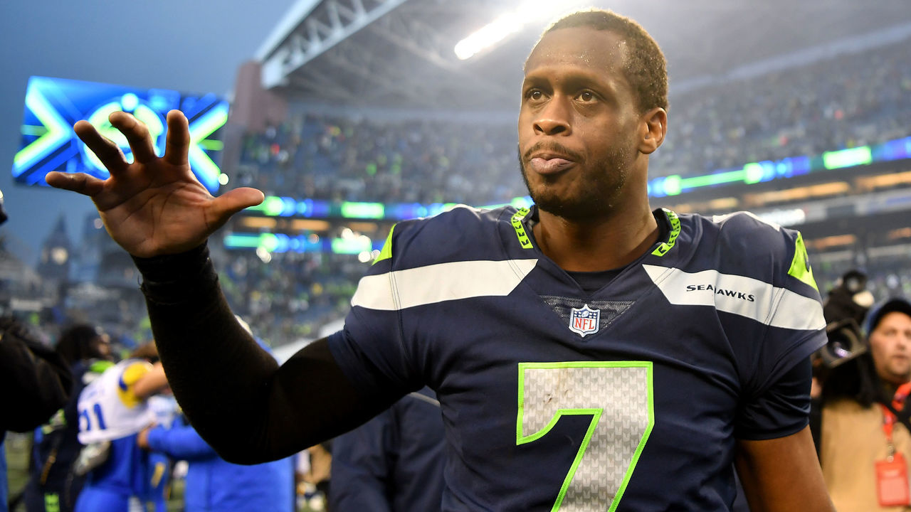 SEATTLE, WASHINGTON - JANUARY 08: Geno Smith #7 of the Seattle Seahawks celebrates after defeating the Los Angeles Rams in overtime at Lumen Field on January 08, 2023 in Seattle, Washington.