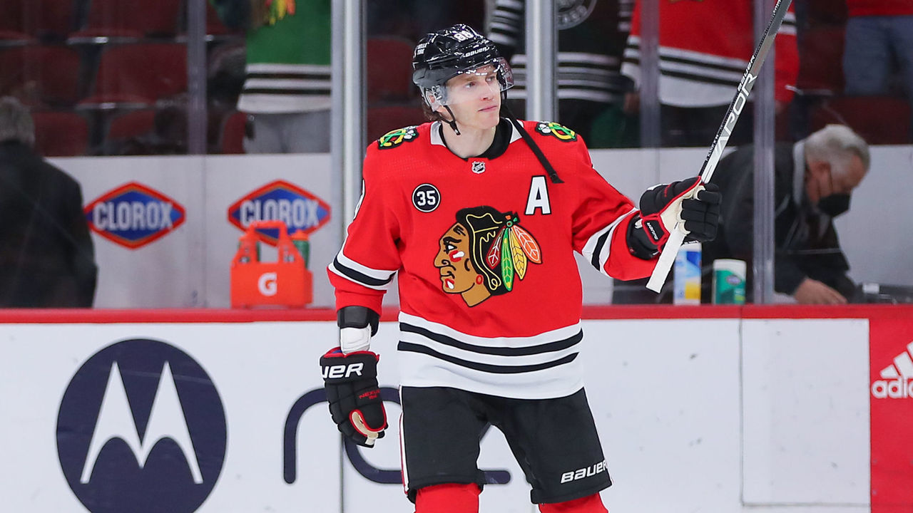 CHICAGO, IL - MARCH 08: Chicago Blackhawks right wing Patrick Kane (88) raises his hockey stick to salute the crowd after a game between the Anaheim Ducks and the Chicago Blackhawks on March 8, 2022 at the United Center in Chicago, IL.