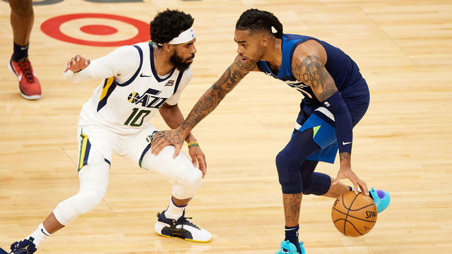 MINNEAPOLIS, MINNESOTA - APRIL 26: Mike Conley #10 of the Utah Jazz defends against D'Angelo Russell #0 of the Minnesota Timberwolves during the third quarter of the game at Target Center on April 26, 2021 in Minneapolis, Minnesota. The Timberwolves defeated the Jazz 105-104.